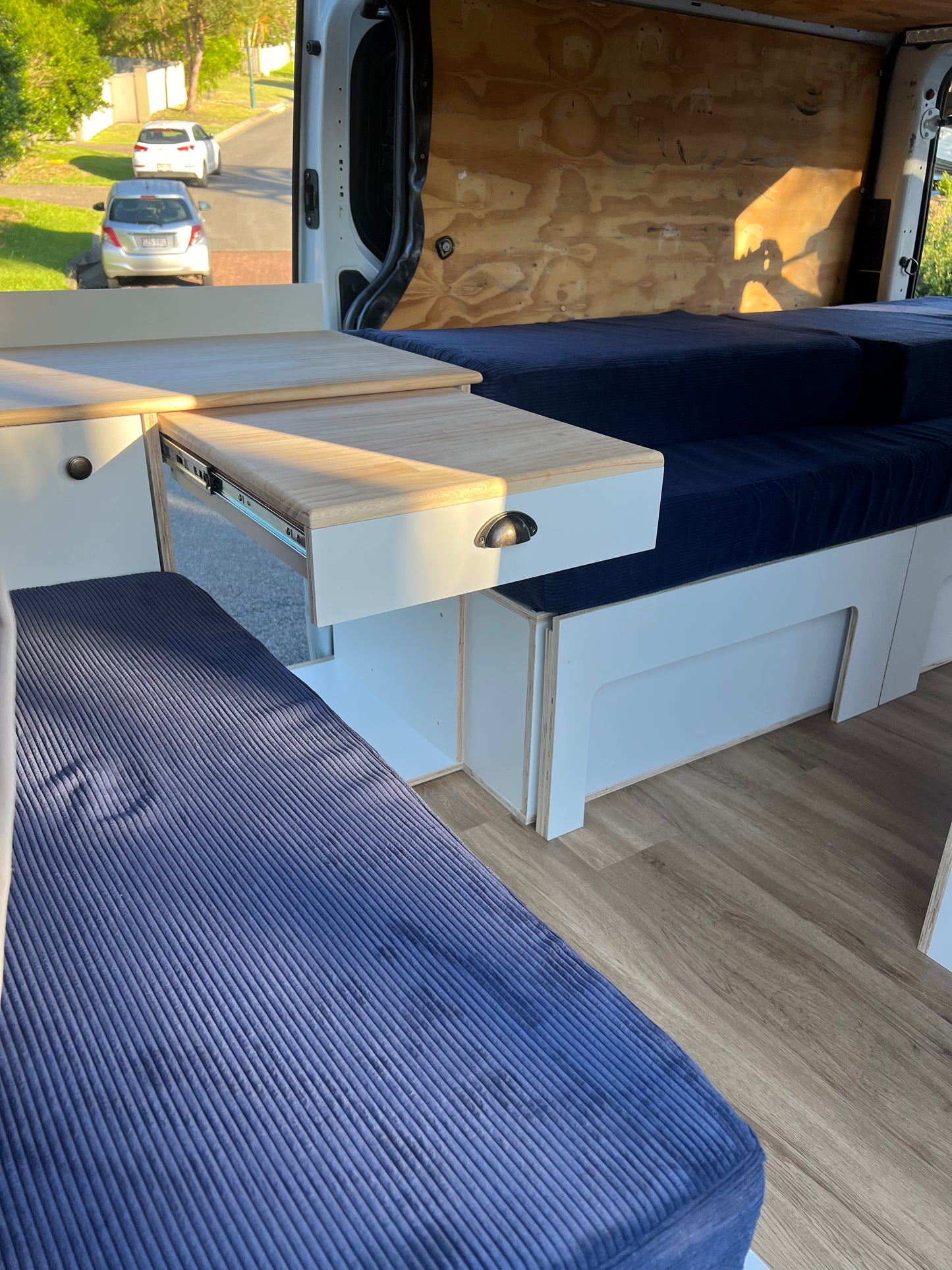 Sample of front unit with sliding out table and part of the side sliding bed frame in a Renault Trafic campervan