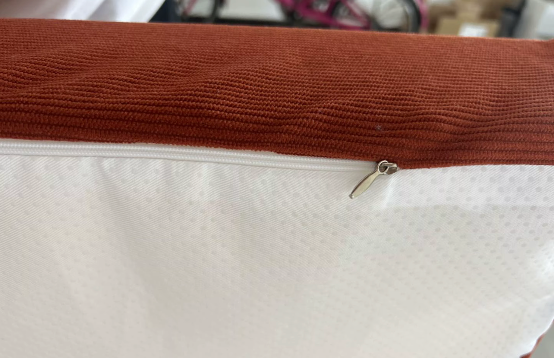 Rich amber corduroy campervan mattress showing the specialised white anti-slip material on the bottom side to prevent sliding on the bed frame.