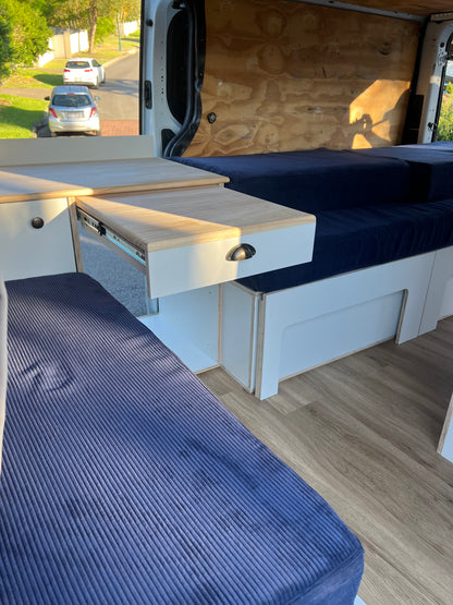 Sample of front unit with sliding out table and part of the side sliding bed frame in a Renault Trafic campervan